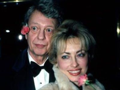 Loralee Czuncha is holding the flower while Don Knotts has kept it in his ear.